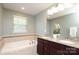 Bathroom features a soaking tub and double vanity at 1809 Evergreen Dr, Charlotte, NC 28208