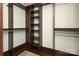 Walk-in closet with custom shelves and rods at 1809 Evergreen Dr, Charlotte, NC 28208