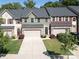 Attractive townhomes with well-manicured lawns, attached garages, and inviting curb appeal at 1809 Evergreen Dr, Charlotte, NC 28208