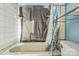 Bathroom featuring tile walls and a shower-tub combo at 1908 5Th St, Statesville, NC 28677