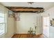 Bedroom featuring hardwood floors, damage to the ceiling and walls, and peeling paint at 1908 5Th St, Statesville, NC 28677