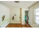 Bedroom featuring hardwood floors, damage to the walls and trim, and peeling paint at 1908 5Th St, Statesville, NC 28677