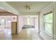 View of the dining room area with tile flooring and a view of the kitchen at 1908 5Th St, Statesville, NC 28677