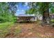 Charming home in a wooded setting with a cozy front porch at 1908 5Th St, Statesville, NC 28677