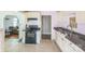 Kitchen featuring tile floors, cream colored cabinets and black appliances at 1908 5Th St, Statesville, NC 28677