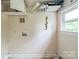 Laundry room with washer and dryer hookups and storage shelves at 1908 5Th St, Statesville, NC 28677