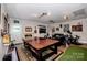 Finished basement with a ping pong table, golf simulator and bar area at 195 Brookfield Cir, Mooresville, NC 28115
