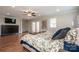 Spacious bedroom with hardwood floors, ceiling fan and access to a door to the exterior at 195 Brookfield Cir, Mooresville, NC 28115