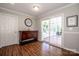 Bright dining area featuring a classic buffet, hardwood floors and access to the screened porch at 195 Brookfield Cir, Mooresville, NC 28115