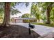 Charming brick home featuring mature trees, a two-car garage, and a long, paved driveway at 195 Brookfield Cir, Mooresville, NC 28115