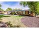 Charming brick home with manicured landscaping, a green lawn, and a paved driveway leading to a two-car garage at 195 Brookfield Cir, Mooresville, NC 28115