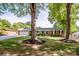 Lovely brick home with mature trees, a green lawn, and a paved driveway leading to a two-car garage at 195 Brookfield Cir, Mooresville, NC 28115