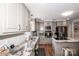 Well-lit kitchen with stainless appliances and granite countertops at 195 Brookfield Cir, Mooresville, NC 28115