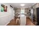 Updated kitchen with stainless steel appliances and breakfast bar at 195 Brookfield Cir, Mooresville, NC 28115