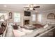 Comfortable living room with gray sectional sofa and cozy fireplace at 195 Brookfield Cir, Mooresville, NC 28115