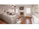 Cozy living room features a fireplace, a ceiling fan and neutral paint colors at 195 Brookfield Cir, Mooresville, NC 28115