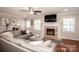 Bright living room showcases a fireplace and large sectional sofa at 195 Brookfield Cir, Mooresville, NC 28115