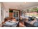 Inviting screened porch with a ceiling fan and views of the fenced backyard at 195 Brookfield Cir, Mooresville, NC 28115