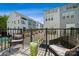 Relaxing balcony with outdoor seating and views of the surrounding townhome community at 2009 Clarksdale Dr # 39, Charlotte, NC 28206
