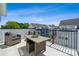 Outdoor balcony featuring stylish furniture, a decorative table setting, and neighborhood views at 2009 Clarksdale Dr # 39, Charlotte, NC 28206