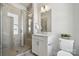 Modern bathroom featuring a glass-enclosed shower, white vanity, and contemporary fixtures at 2009 Clarksdale Dr # 39, Charlotte, NC 28206