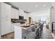 Stylish kitchen with white cabinets, sleek appliances, seating at the island and lots of light at 2009 Clarksdale Dr # 39, Charlotte, NC 28206