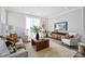 Cozy living room with comfortable seating, modern decor, a large window, and hardwood floors at 2009 Clarksdale Dr # 39, Charlotte, NC 28206