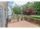 Spacious wood deck overlooking an expansive backyard with beautiful landscaping and mature trees at 212 Forest Walk Way, Mooresville, NC 28115