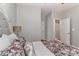 This cozy bedroom features a floral bedspread and decorative pillows atop a comfortable-looking bed at 212 Forest Walk Way, Mooresville, NC 28115