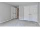 This bedroom offers multiple closets, neutral carpet, and ample space at 212 Forest Walk Way, Mooresville, NC 28115