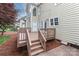 A wooden deck overlooks backyard, offering a space for outdoor entertaining at 212 Forest Walk Way, Mooresville, NC 28115