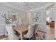 Sophisticated dining area with an elegant light fixture, large mirror, and comfortable seating at 212 Forest Walk Way, Mooresville, NC 28115