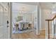 Elegant dining room with modern chandelier, stylish decor, and ample seating for Gathering gatherings at 212 Forest Walk Way, Mooresville, NC 28115