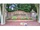 A charming Cherry Grove brick entrance sign surrounded by lush landscaping and mature trees at 212 Forest Walk Way, Mooresville, NC 28115