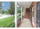 Inviting porch with views of the neighborhood street and manicured landscaping at 212 Forest Walk Way, Mooresville, NC 28115