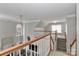 The carpeted second story landing features a view of the living area, staircase, and rooms nearby at 212 Forest Walk Way, Mooresville, NC 28115