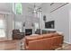 Bright living room boasting a fireplace, soaring ceilings and multiple windows with natural light at 212 Forest Walk Way, Mooresville, NC 28115