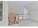 The loft is open and airy with staircase and railing that overlook the living area with lots of light at 212 Forest Walk Way, Mooresville, NC 28115