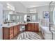 This main bathroom is equipped with a double sink vanity, granite countertops, soaking tub and natural light at 212 Forest Walk Way, Mooresville, NC 28115