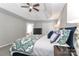 A calming main bedroom is adorned with a decorative tray ceiling, ceiling fan and large windows for lots of light at 212 Forest Walk Way, Mooresville, NC 28115