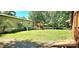 Lawn and patio area, ideal for outdoor activities and relaxation, with lush greenery at 217 Eighth Ave, New London, NC 28127