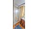 Bathroom with wood cabinets, a vanity and a walk-in shower with glass doors at 217 Eighth Ave, New London, NC 28127