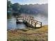 Private dock on the lake with a walkway, where you can relax and enjoy the lake lifestyle at 217 Eighth Ave, New London, NC 28127