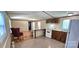 View of the kitchen area, opening up into the living room for easy entertaining at 217 Eighth Ave, New London, NC 28127