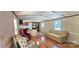 Bright living room featuring wood floors and a seamless flow into the kitchen area at 217 Eighth Ave, New London, NC 28127