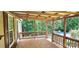 Spacious porch with wood flooring, providing a perfect space to enjoy the outdoors at 217 Eighth Ave, New London, NC 28127