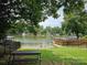 Enjoy lake views from the community's private water access with a picnic table at 217 Eighth Ave, New London, NC 28127