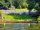 Lake access with benches, stairs to the water, and a well-manicured lawn at 217 Eighth Ave, New London, NC 28127