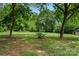 Backyard featuring a green lawn and large trees at 2376 S Us 321 Hwy, Newton, NC 28658