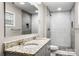 Modern bathroom featuring double vanity with granite countertop and tiled walk-in shower at 2376 S Us 321 Hwy, Newton, NC 28658